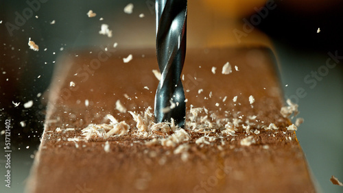 Drilling wooden plank, close-up. © Jag_cz