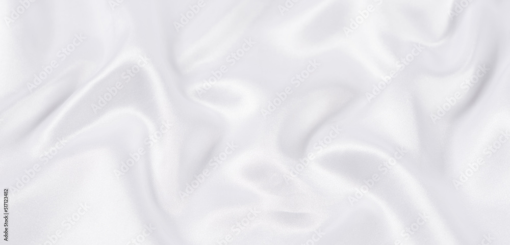Obraz premium white silk fabric texture background. Cloth soft wave. Creases of satin