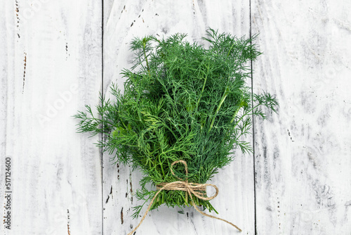 Fresh dill close up on wooden box on light background, preparation for freezing serving size organic healthy ething natural product portion. place for text