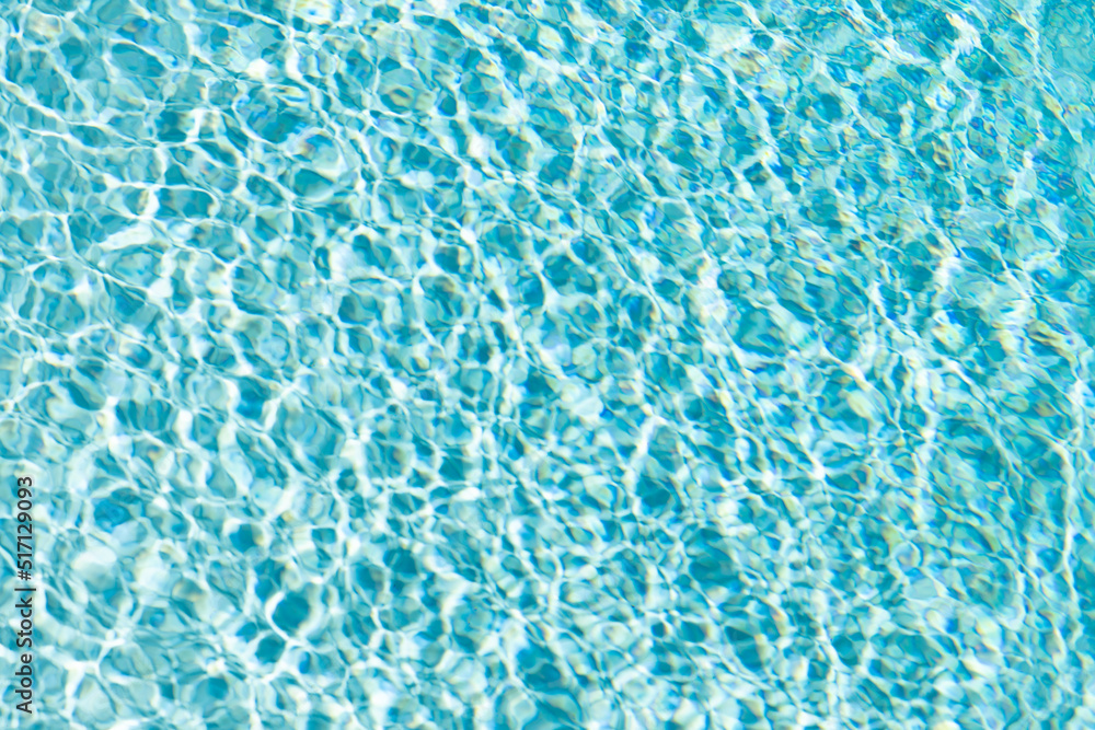 rippled water waves blue color in summer swimming pool