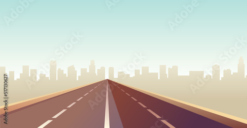 Empty highway. Straight road through to city landscape. Metropolis on background. Asphalt way and town land view