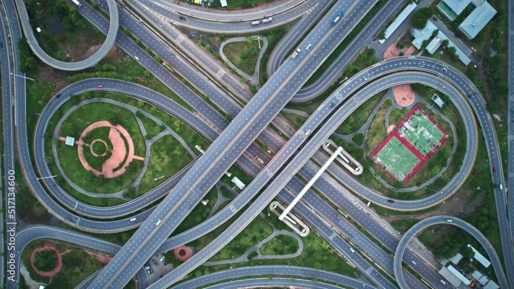 4K : Aerial view shot of fast moving above interchange and multi junction road. traffic time lapse. infrastructure in thailand. hyperlapse. traffic in Thailand
4K : Aerial view shot of fast moving above interchange and multi junction road. traffic time lapse. infrastructure in thailand. hyperlapse. traffic in Thailand