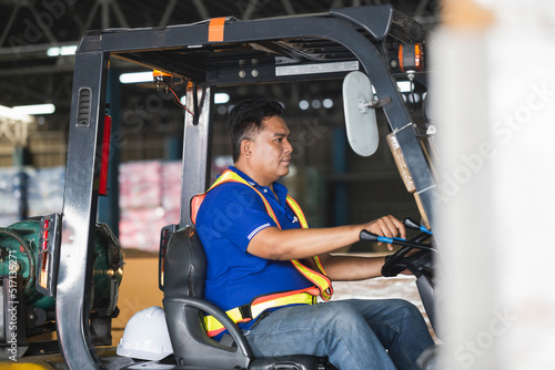 Worker on forklift, Manual workers working in warehouse, Worker driver at warehouse forklift loader works