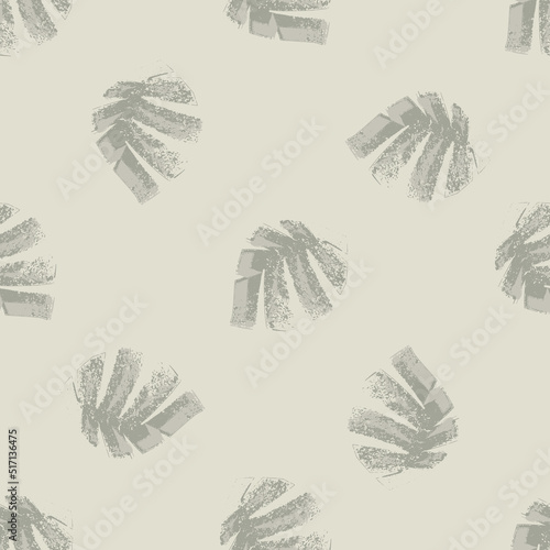 Mono print style scattered leaves seamless vector pattern background. Textured cut out grunge foliage on beige backdrop. Hand crafted painterly design. Neutral ecru all over print for packaging