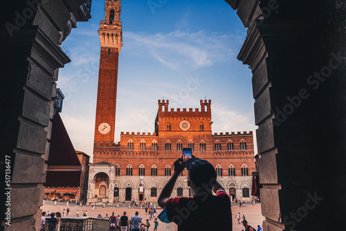 SIENA, ITALY-SEPTEMBER 2021: Tourists visiting Piazza del Campo