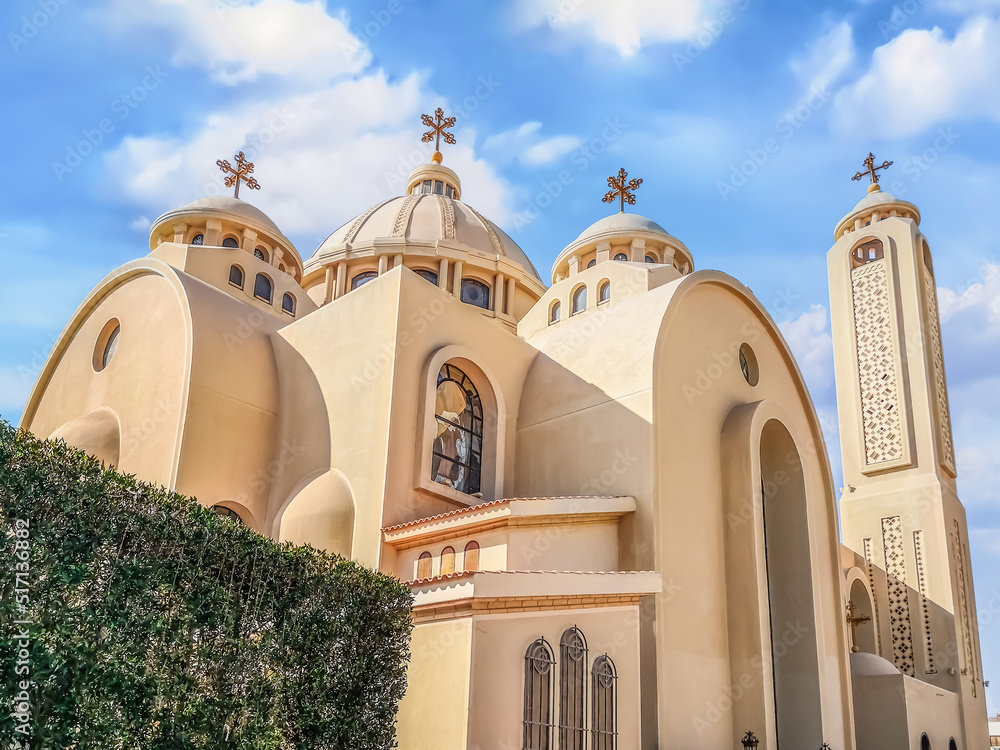 Exterior of modern El sama Eyeen Coptic Church in Sharm El Sheikh, Egypt. Facade of an Egyptian Orthodox temple against a blue sky
