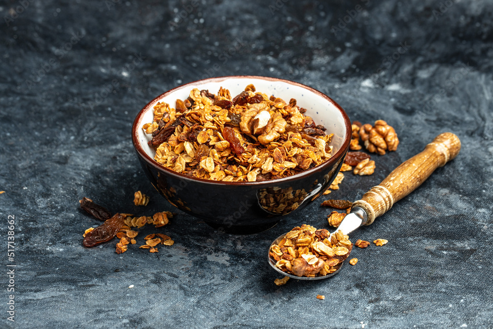 Fototapeta premium Bowl with granola on a blue background. superfood concept. Healthy, clean eating. Vegan or gluten free diet. Long banner format. top view