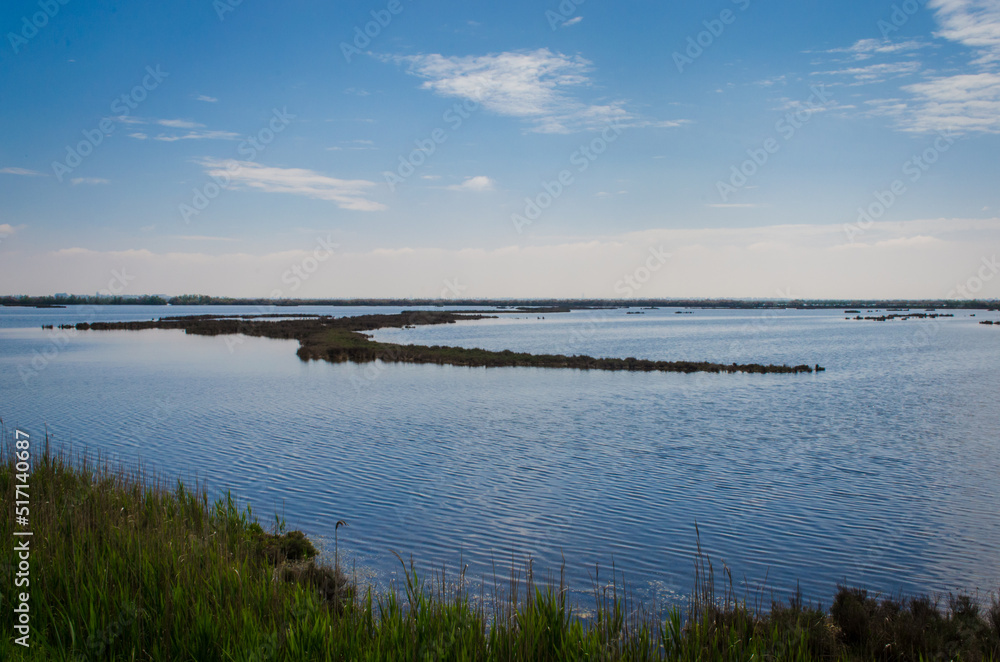 Paesaggio della laguna nord di Venezia visto dalla Via Postumia, cammino che parte da Aquileia e arriva a Genova Paesaggio della laguna nord di Venezia visto dalla Via Postumia, cammino che parte da Aquileia e arriva a Genova