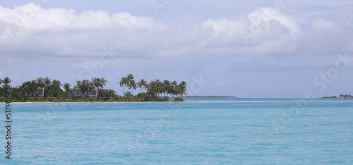 Maldives resort island with palm trees