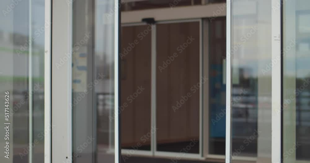 Happy multiethnic couple with bags leave shopping center. Realtime Happy multiethnic couple with bags leave shopping center. Realtime