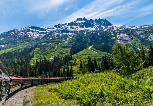 A view from a train crossing a bridge on the White Pass and Yukon railway near Skagway, Alaska in summertime