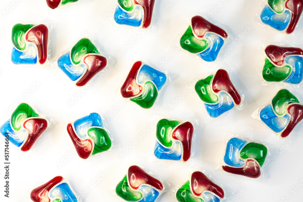 abstract dishwasher detergent pods on white background, flat lay