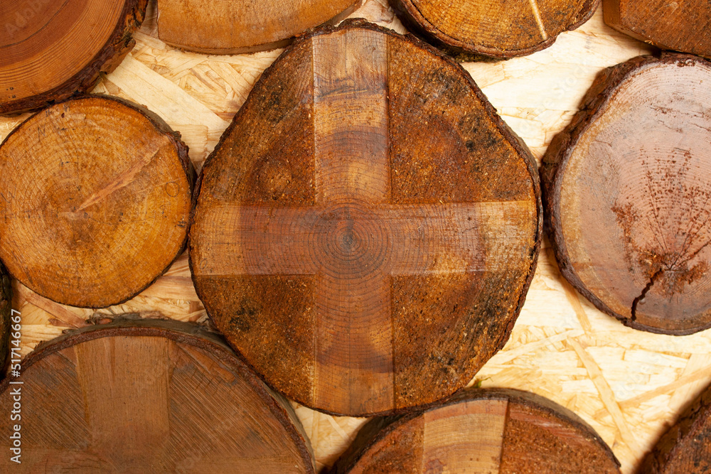 Tree rings old weathered wood texture with the cross section of a cut log. Tree rings old weathered wood texture with the cross section of a cut log.