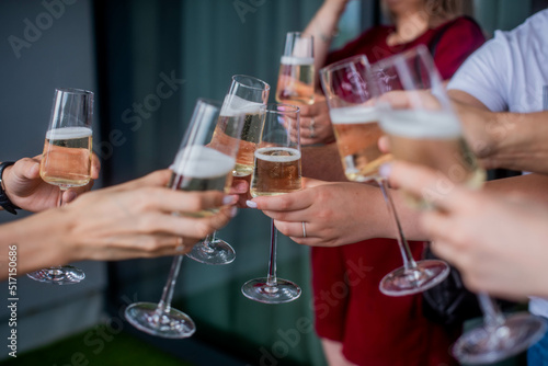 friends clink champagne glasses. Bride with jewelry and wedding ring © MartaKlos