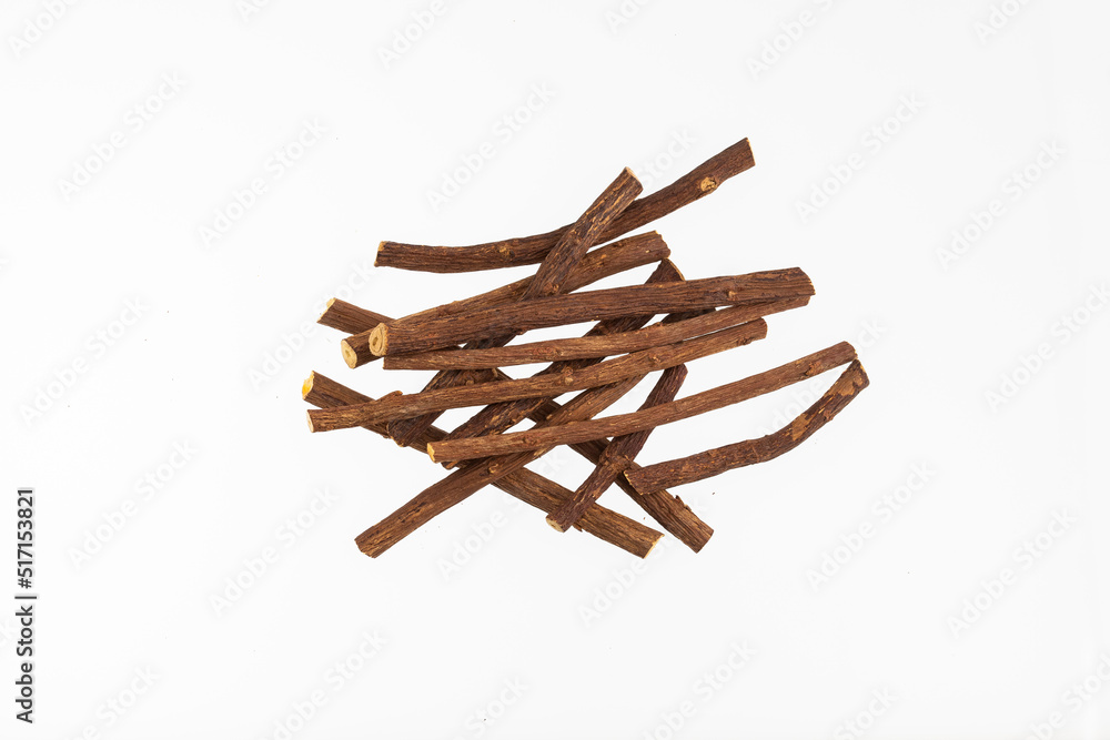 Close up of Ayurvedic herb Liquorice root,Licorice root, Mulethi or Glycyrrhiza glabra root on a wooden surface is very much beneficial for Soothes your stomach,poisoning, stomach ulcers. Close up of Ayurvedic herb Liquorice root,Licorice root, Mulethi or Glycyrrhiza glabra root on a wooden surface is very much beneficial for Soothes your stomach,poisoning, stomach ulcers.