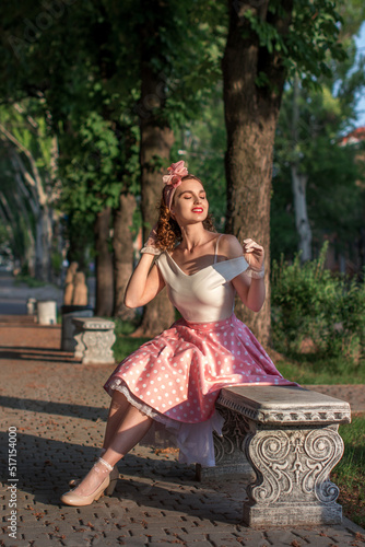 Obraz na plátně Bright color photo of a beautiful girl with curly hair in a retro style of the 5