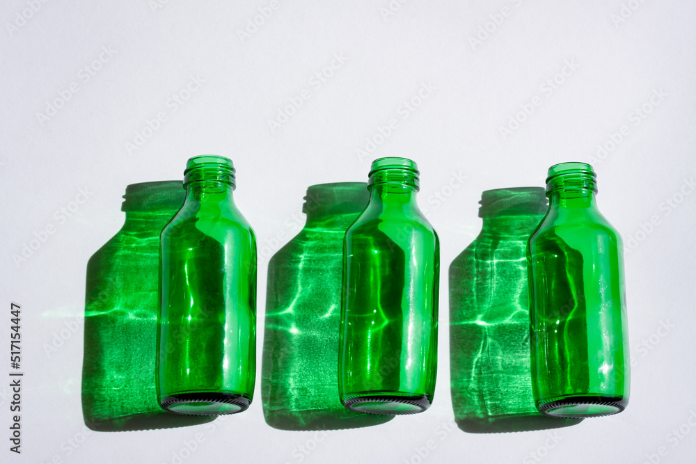 Green glass bottles with shadow and light effect Green glass bottles with shadow and light effect