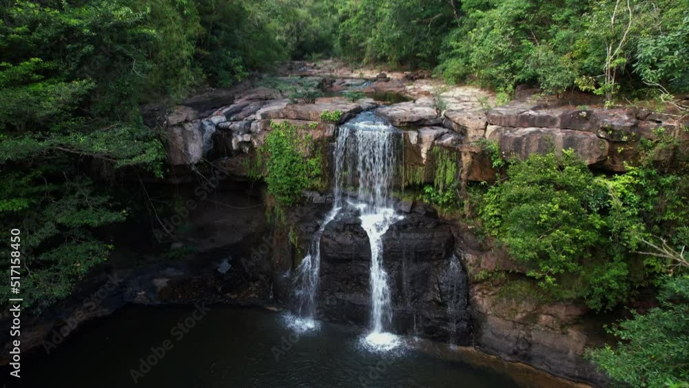 Aerial drone shot from the front of a waterfall to rainforest canopy overview, Koh Kood island, Thailand Aerial drone shot from the front of a waterfall to rainforest canopy overview, Koh Kood island, Thailand