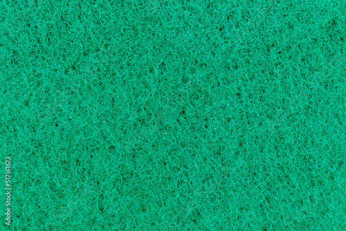 Spugna ruvida verde da pulizia, vista superiore, macro photo