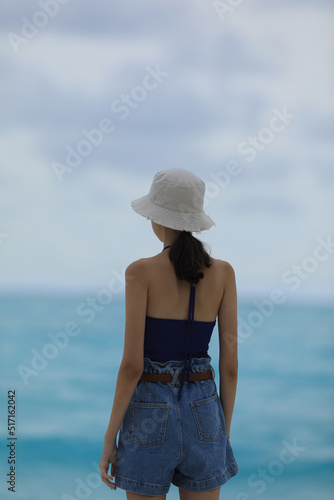 teenage girl looking at the ocean © serikbaib