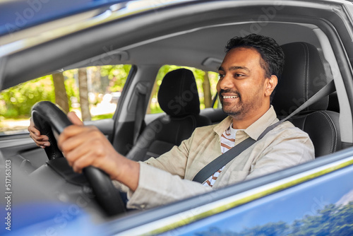 transport, vehicle and people concept - happy smiling indian man or driver driving car