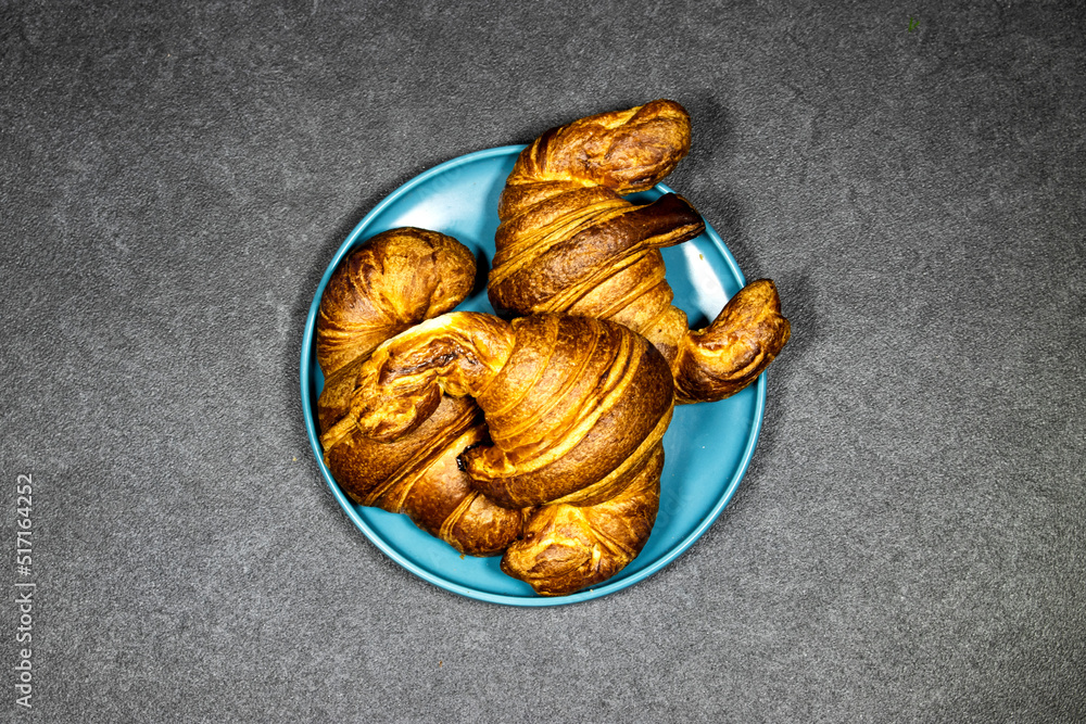 morning concept - Fresh baked croissants in plate  for breakfast