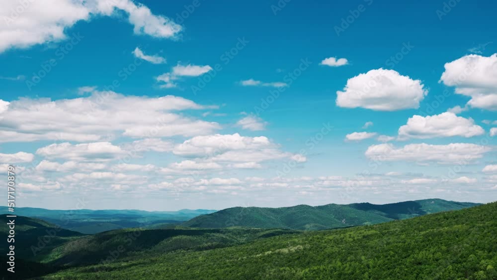 Amazing natural landscape with clouds floating across sky casting shadows on green hills. Timelapse. Beautiful scenery of mountains covered with trees, bushes, grass. Picturesque countryside Amazing natural landscape with clouds floating across sky casting shadows on green hills. Timelapse. Beautiful scenery of mountains covered with trees, bushes, grass. Picturesque countryside