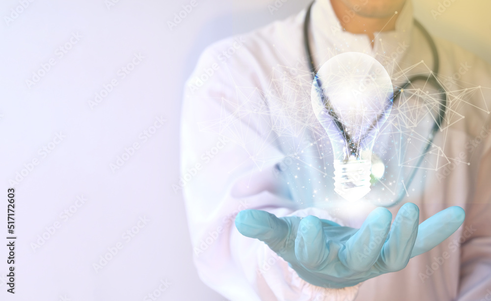 Fototapeta premium Innovation. Concept new idea concept with innovation and inspiration, hands holding a light bulb Medical technology, digital healthcare, and network connection via hologram virtual interface.