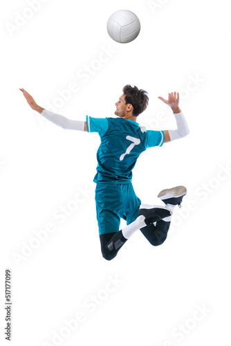 Portrait of young man, volleyball player in motion, training, playing isolated over white studio background