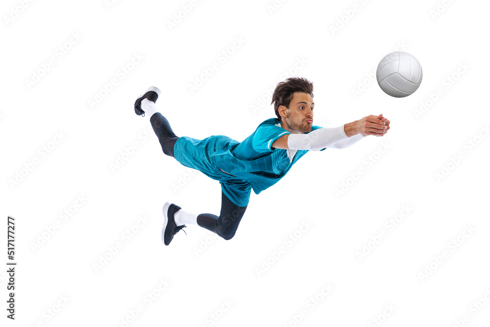 Portrait of young man, volleyball player in motion, training, playing isolated over white studio background. Bumping. In a jump Portrait of young man, volleyball player in motion, training, playing isolated over white studio background. Bumping. In a jump