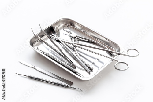 Obraz na plátně Medical equipment tools instruments in steel tray at doctor desk