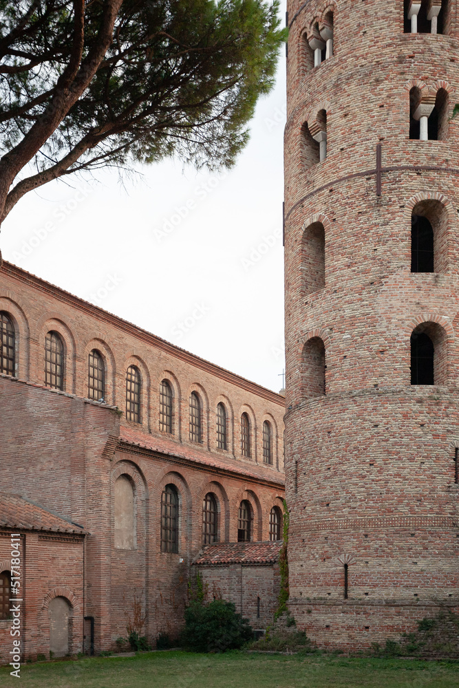 Part of the facade and tower of a Romanesque basilica.