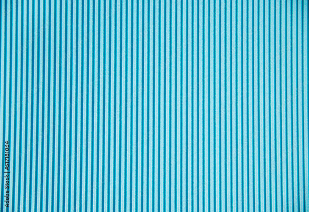Abstract background made of corrugated paper for blue application. Space for text. Texture. Vertical stripes. Abstract background made of corrugated paper for blue application. Space for text. Texture. Vertical stripes.