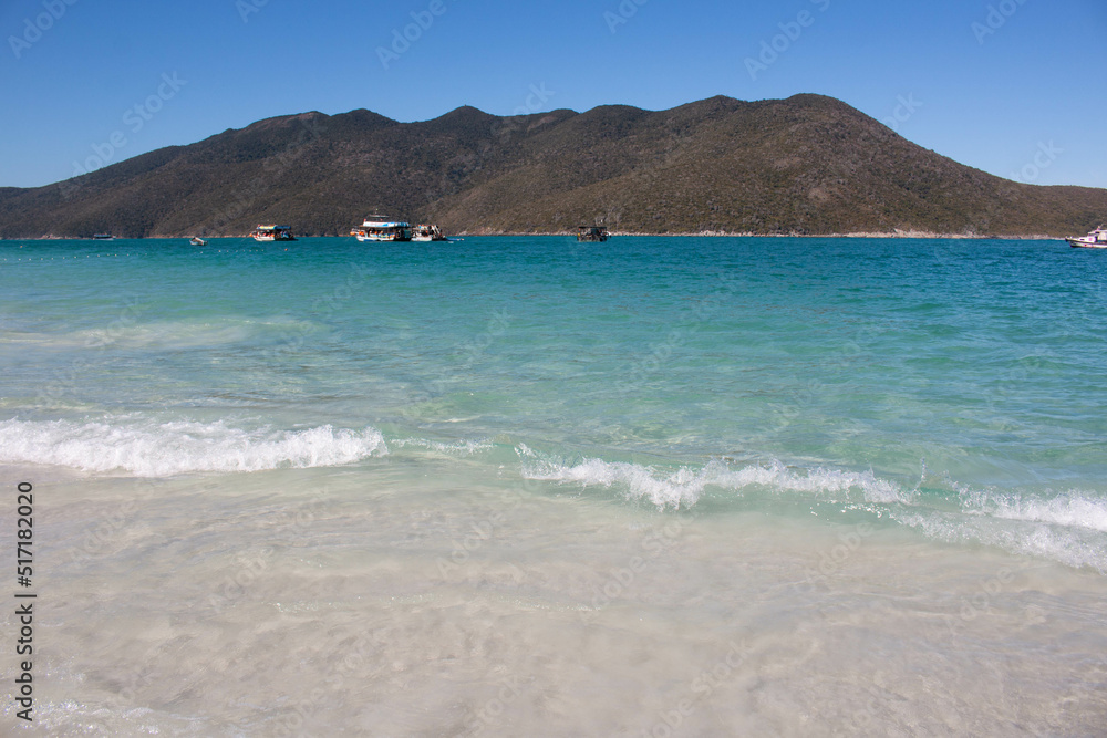 Crystalline and turquoise waters at Pontal do Atalaia beach in Cabo Frio, Brazil. 