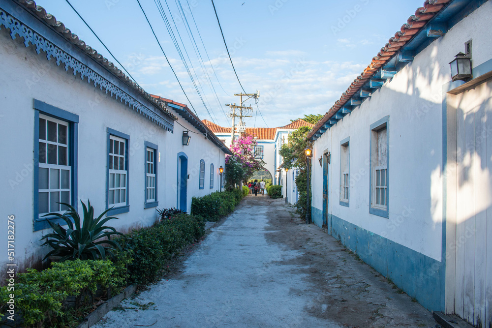 Street with typical blue and white colonial houses, in the neighborhood of Passage, Cabo Frio, Brazil.