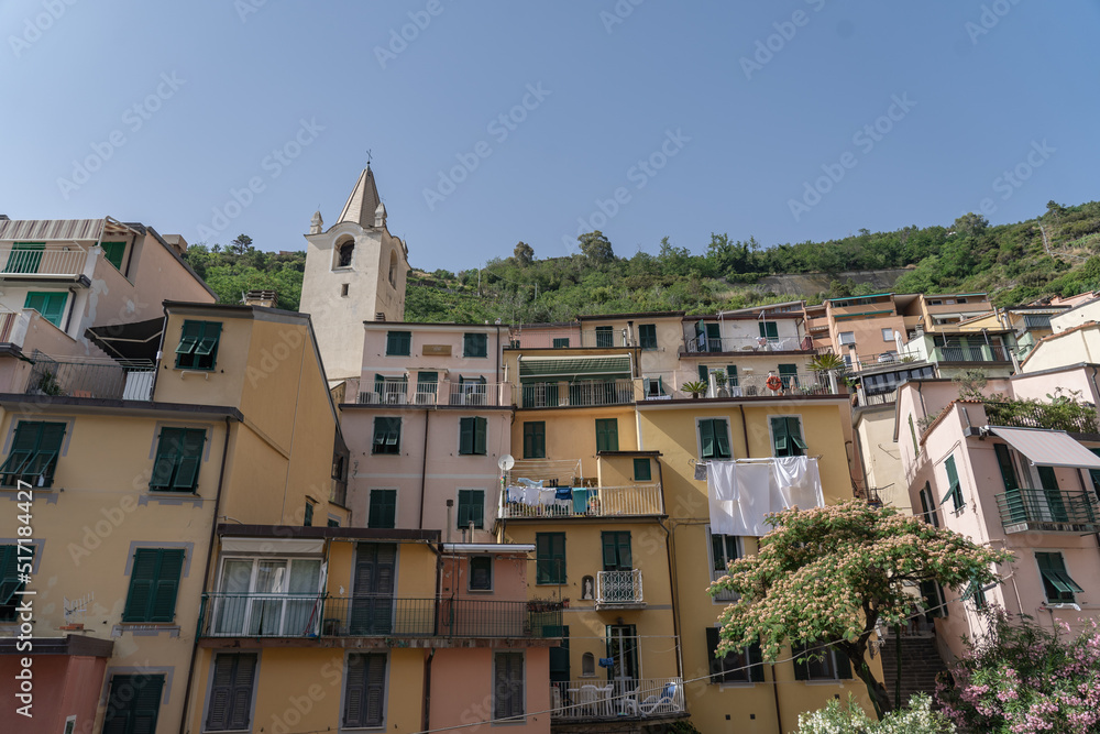 Cinque Terre are five beautiful villages at the coastline of Italy. The villages have colorful houses.