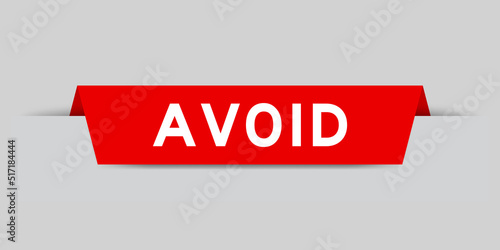 Red color inserted label with word avoid on gray background