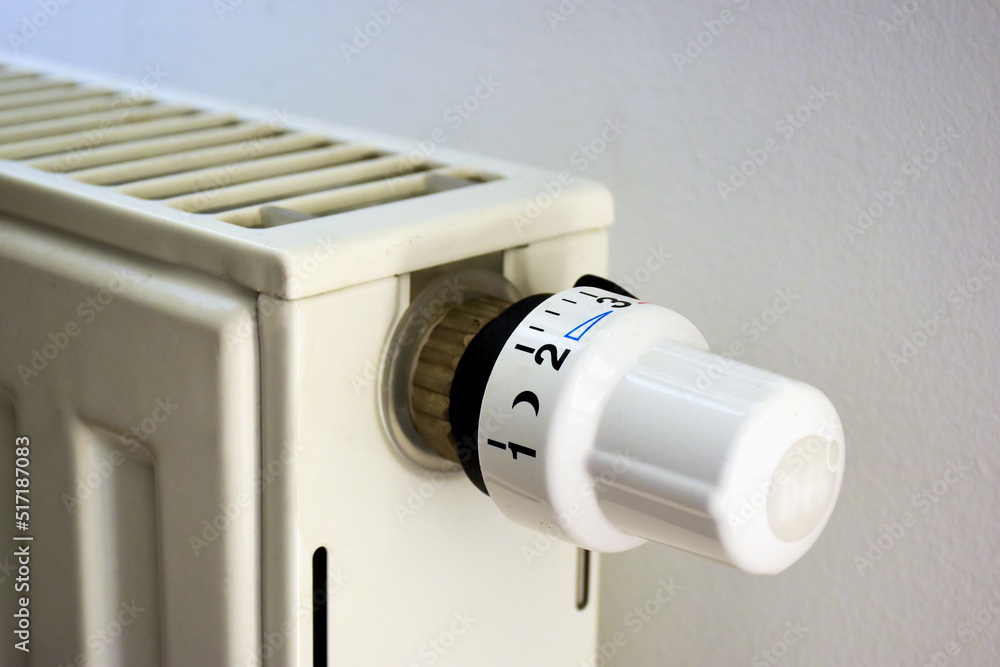 radiator temperature adjusment dial or knob in closeup view. heating conrol and natural gas