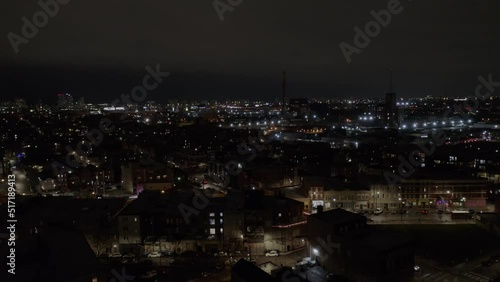 Wallpaper Mural Drone flies upwards over residential houses in the beautiful cityscape of Chicago, USA at night time. Aerial view. Torontodigital.ca