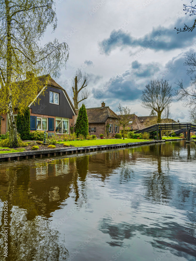 Dutch houses on the canal in the charming village of Giethoorn, Netherlands