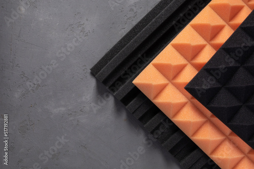 Acoustic foam material on concrete wall background texture. Foam rubber panel for record studio photo