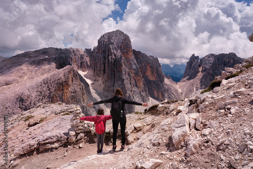 Fotobehang two people observing the altarpieces of san martino dolomites of trentino alto a