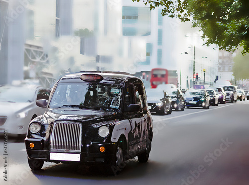 photograph of an English cab-type taxi, which is one of the recognizable pictures of London