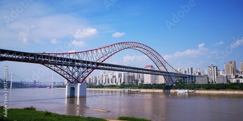 Beautiful view of the Chaotianmen Bridge under the blue sunny sky photo