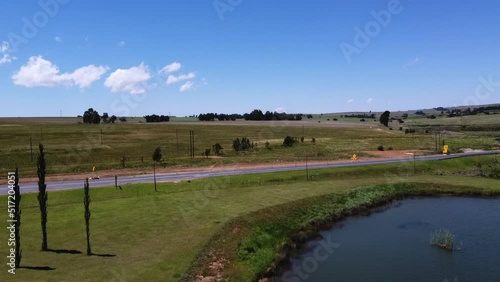 Wallpaper Mural Drone view of a highway with a beautiful lake Torontodigital.ca