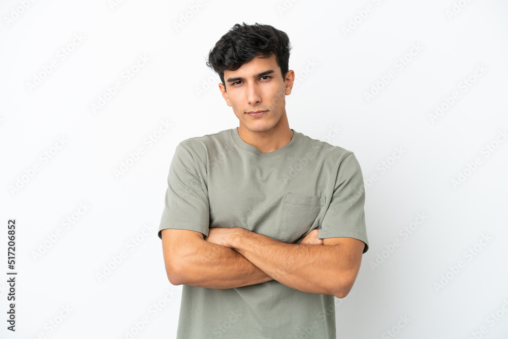 Young Argentinian man isolated on white background with unhappy expression Young Argentinian man isolated on white background with unhappy expression