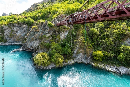 Mesmerizing view of Kawarau Gorge Suspension Bridge over turquoise water, South Island, New Zealand