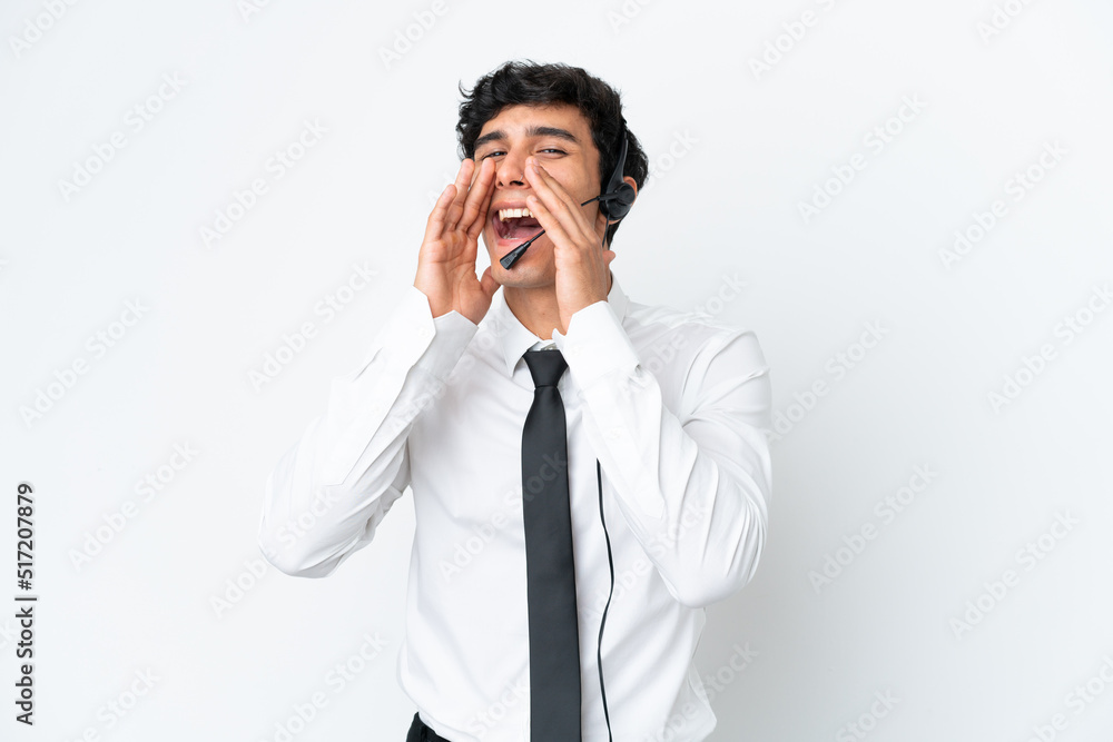 Telemarketer man working with a headset isolated on white background shouting and announcing something Telemarketer man working with a headset isolated on white background shouting and announcing something