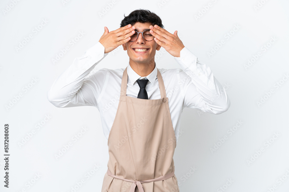 Restaurant Argentinian waiter isolated on white background covering eyes by hands Restaurant Argentinian waiter isolated on white background covering eyes by hands