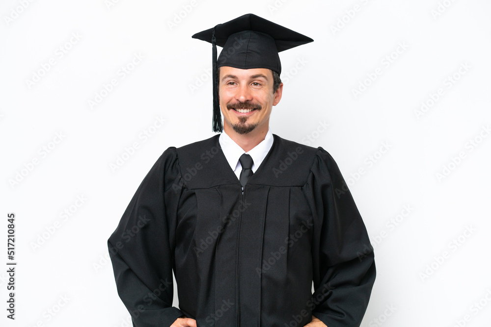 Young university graduate man isolated on white background posing with arms at hip and smiling Young university graduate man isolated on white background posing with arms at hip and smiling
